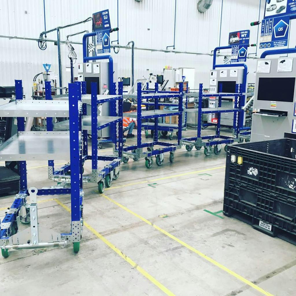 FlexQube flat shelf cart in a tugger train