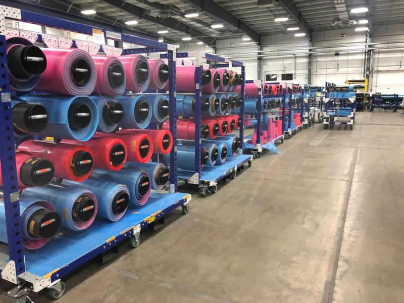 FlexQube Material Handling hanging carts at a factory