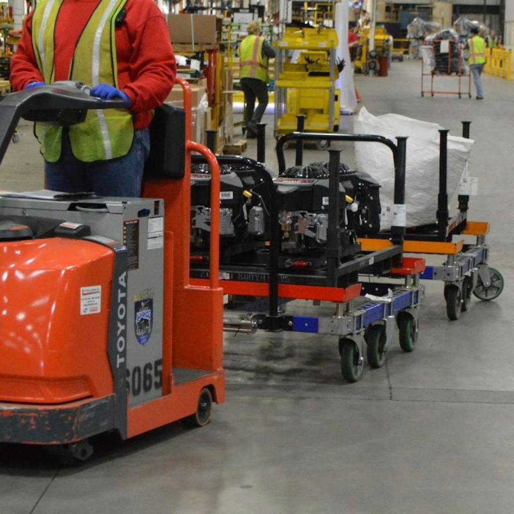 FlexQube 50 x 50 inch tugger carts in a tugger train