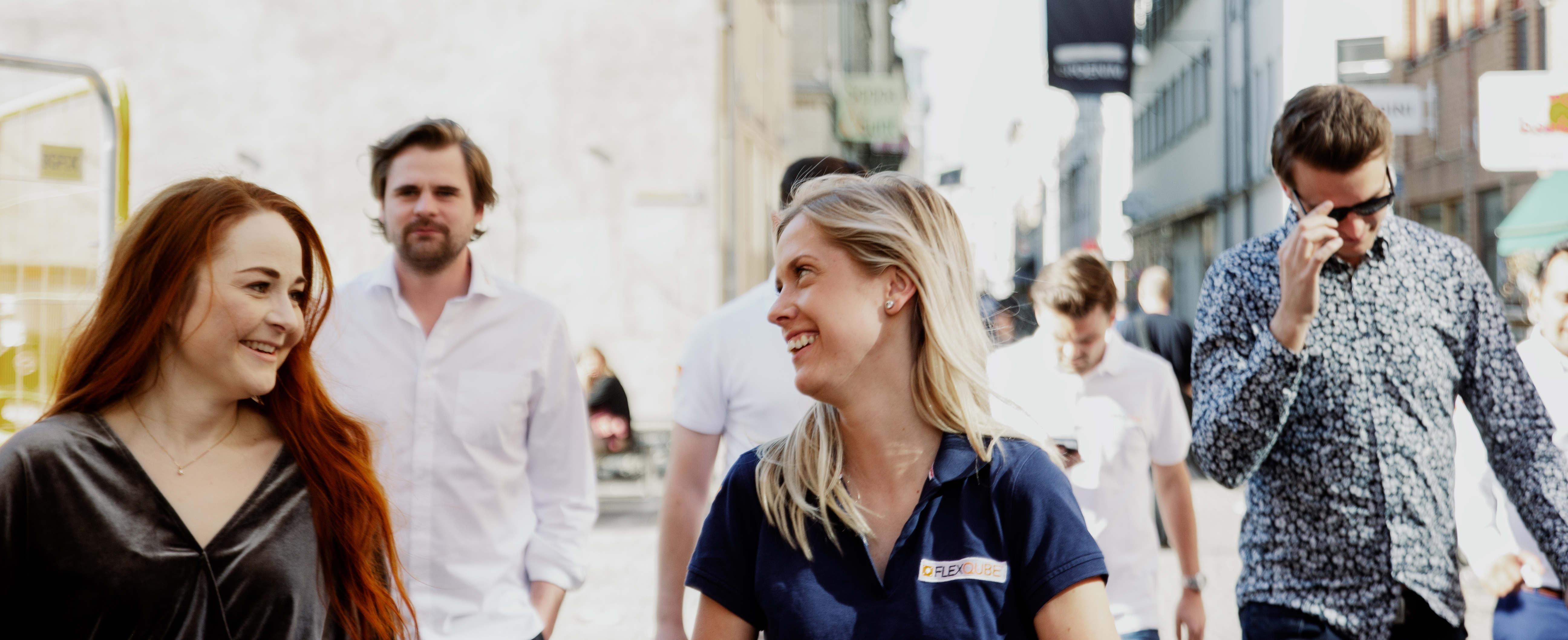 FlexQube staff walking through the street