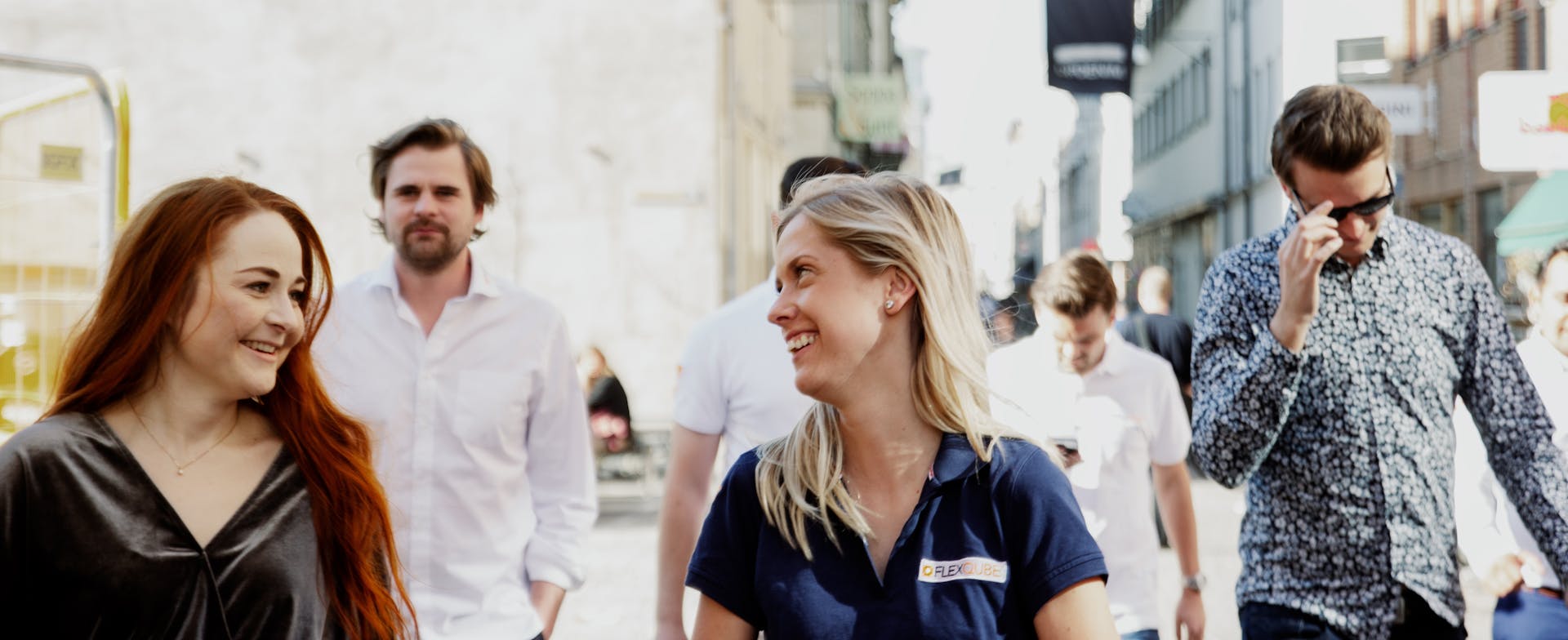 FlexQube staff walking through the street