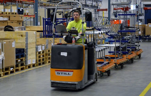 FlexQube kit carts being towed within a Liftrunner system