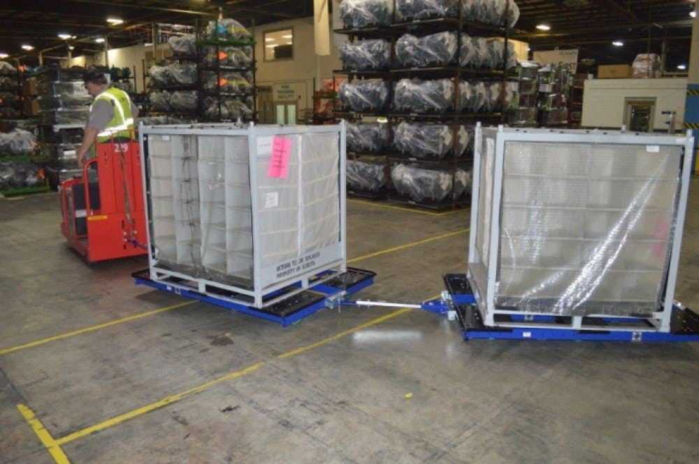 FlexQube tugger carts in a factory