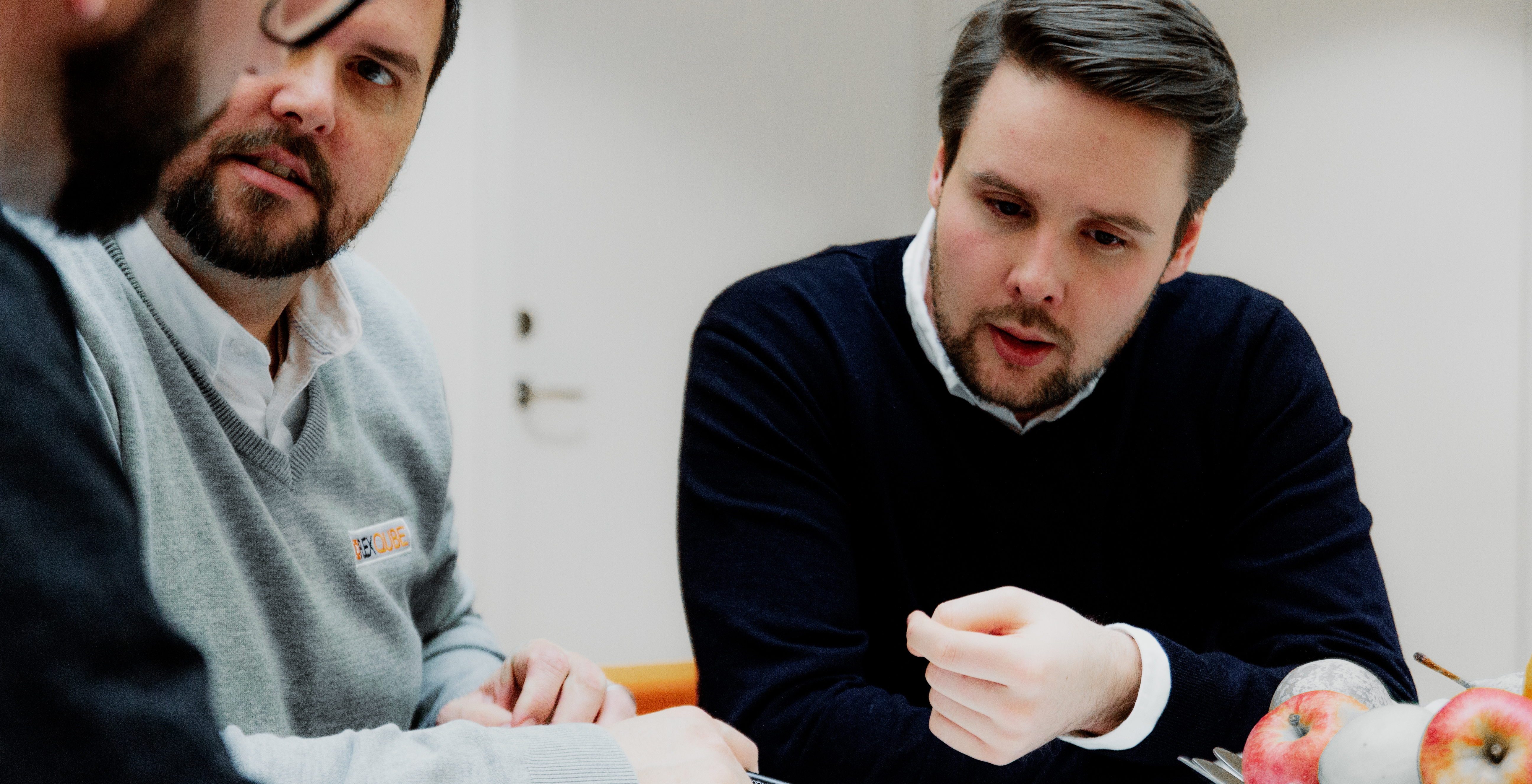 FlexQube employees involved in a design meeting